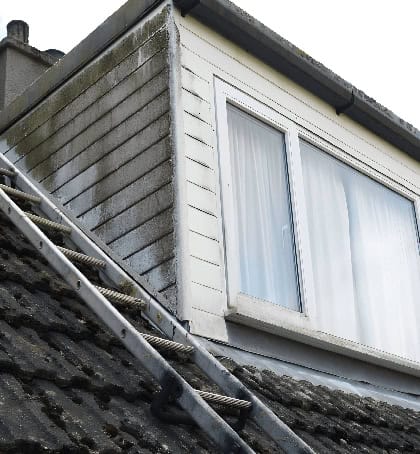 Dirty grimy exterior cladding needing cleaning in Cannock WS11