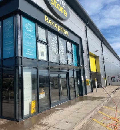 Dirty commercial building windows needing scheduled cleaning in Heath Hayes WS12