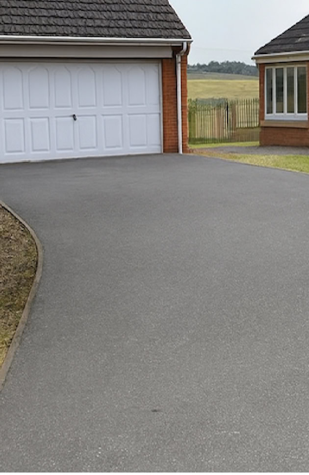 Tarmac before soft-wash treatment in Huntington WS12