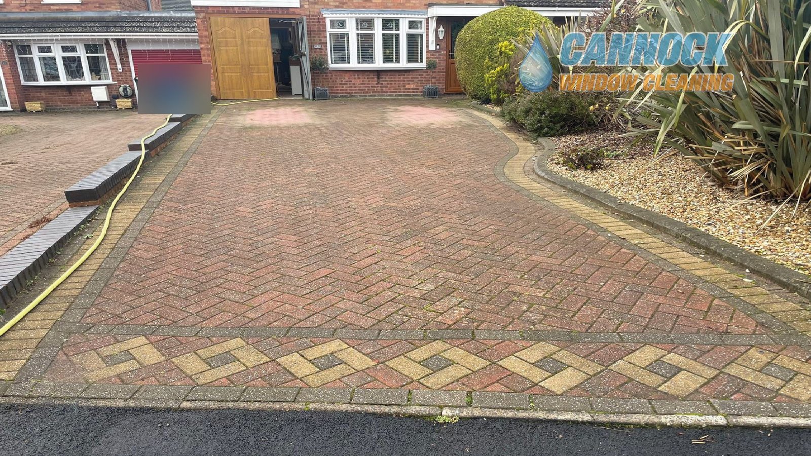 Herringbone drive with a diamond border, dull before cleaning