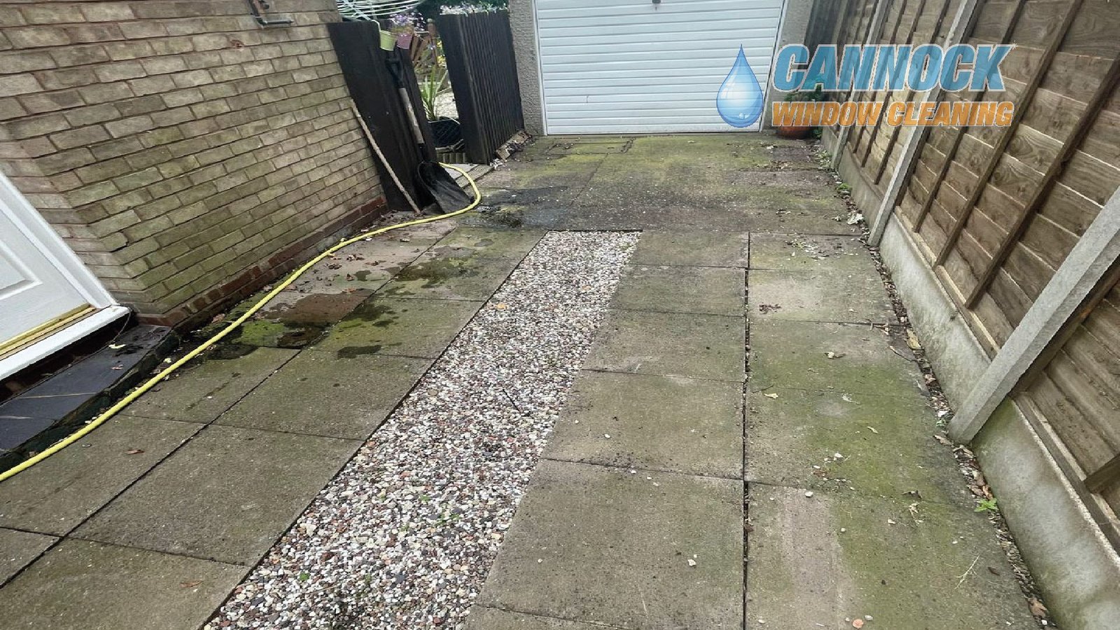 Concrete slab drive green with algae before cleaning