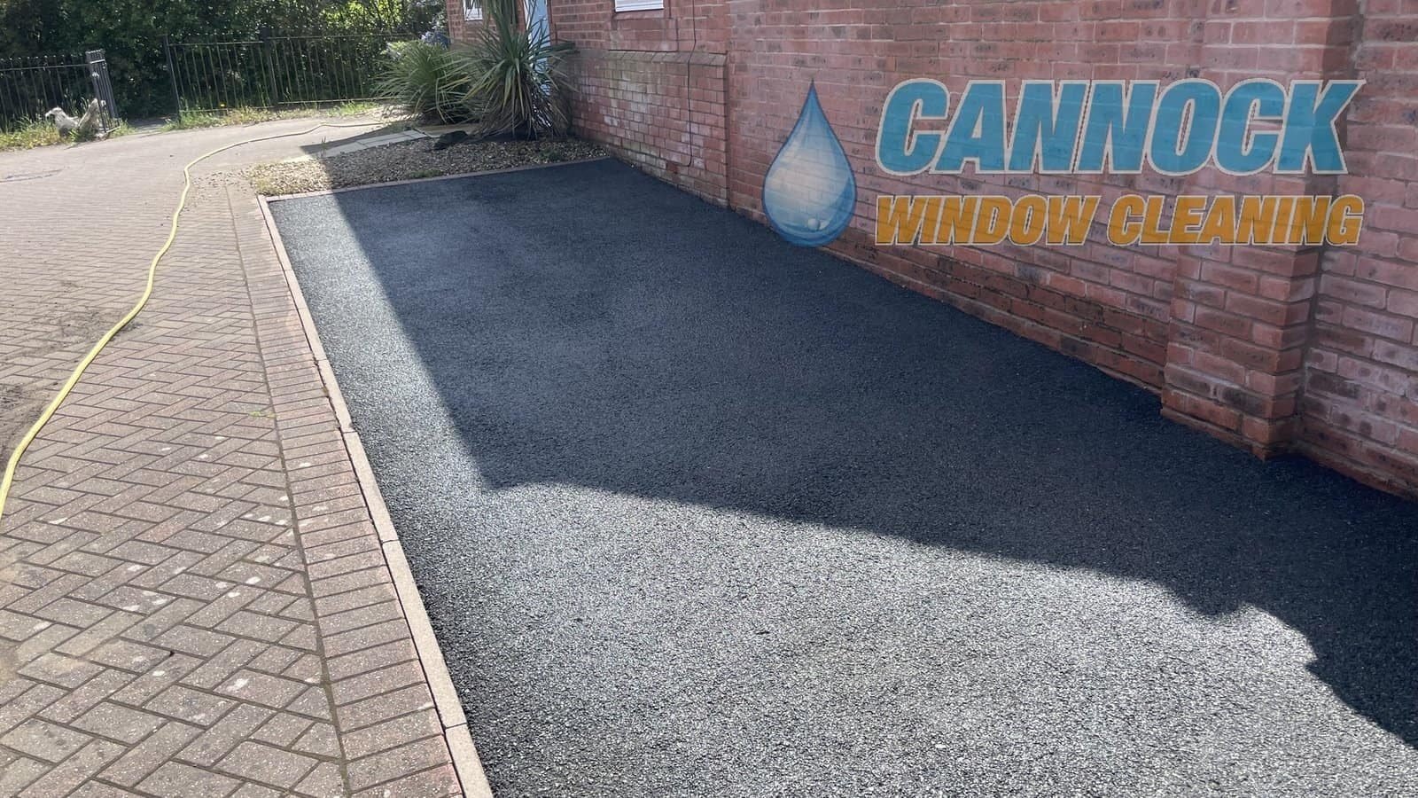 The same tarmac drive black again after cleaning