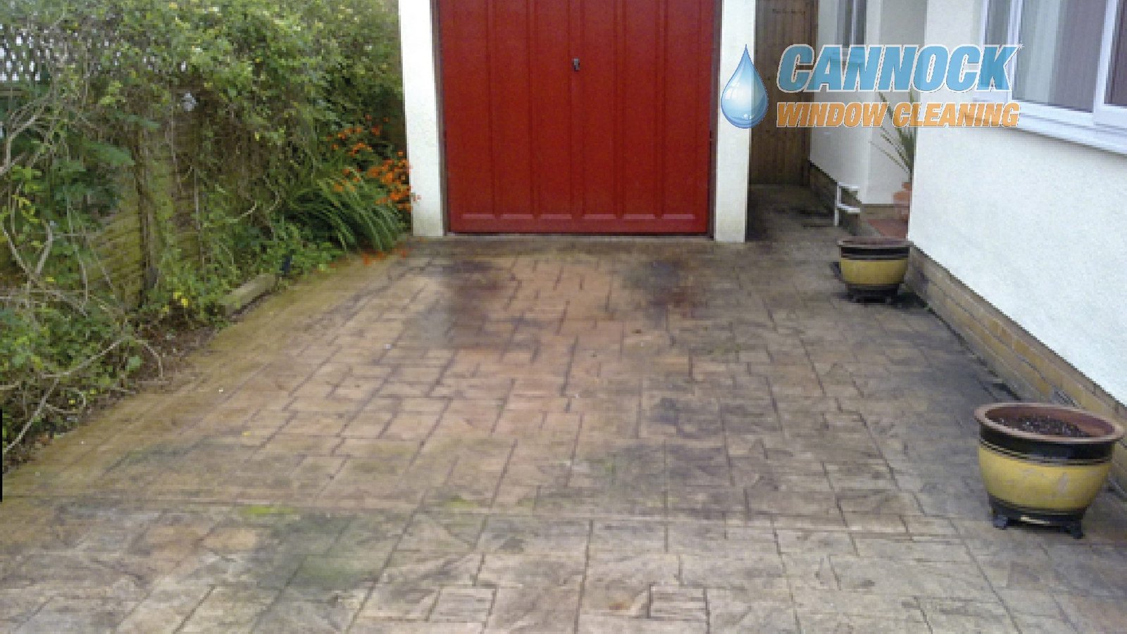 Imprinted concrete drive stained before cleaning