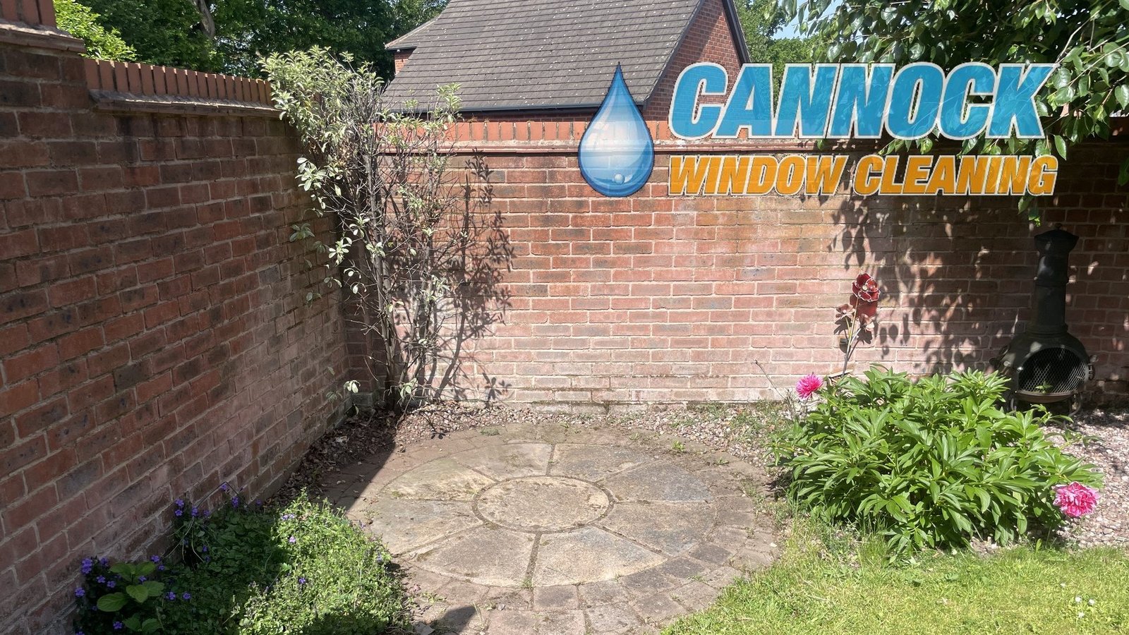 Small circle patio in a garden corner before cleaning
