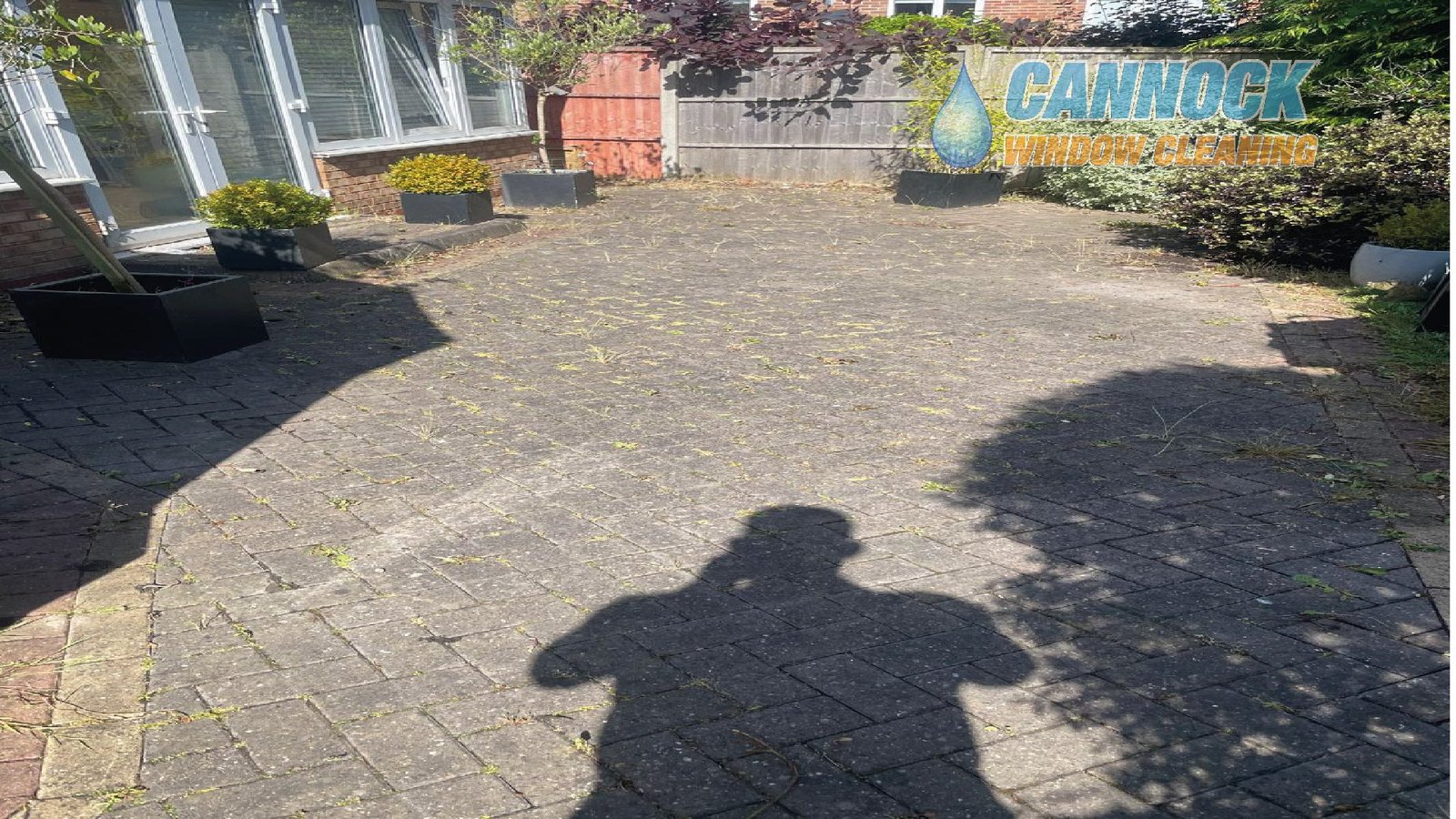 Block paving patio grey with moss before cleaning
